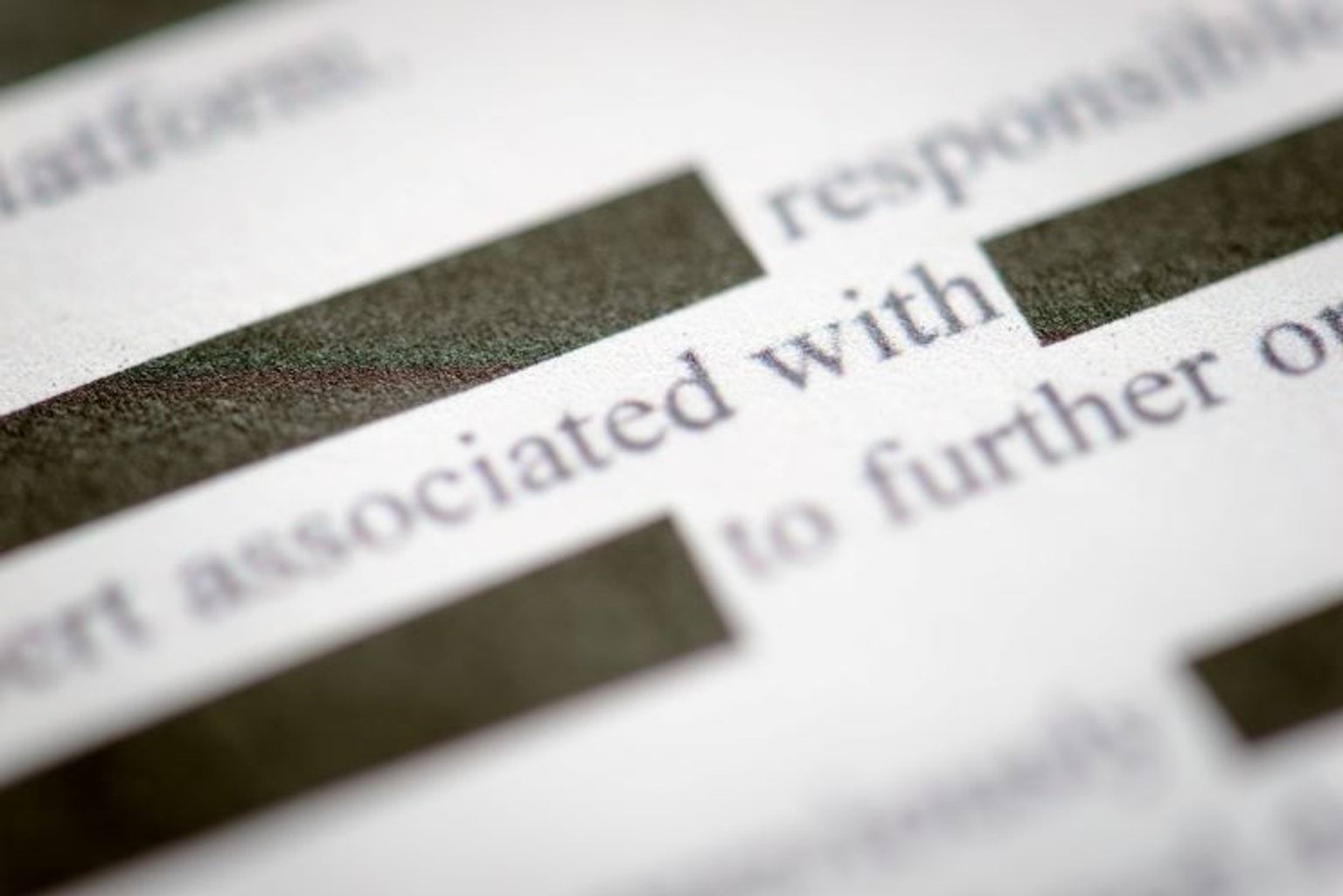 image of documents with redacted text